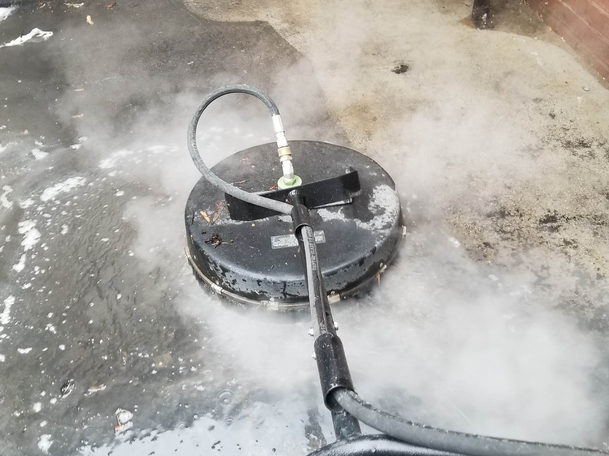 Photo of Penson Pressure Washing team member performing rotary wash service in Atlanta, GA