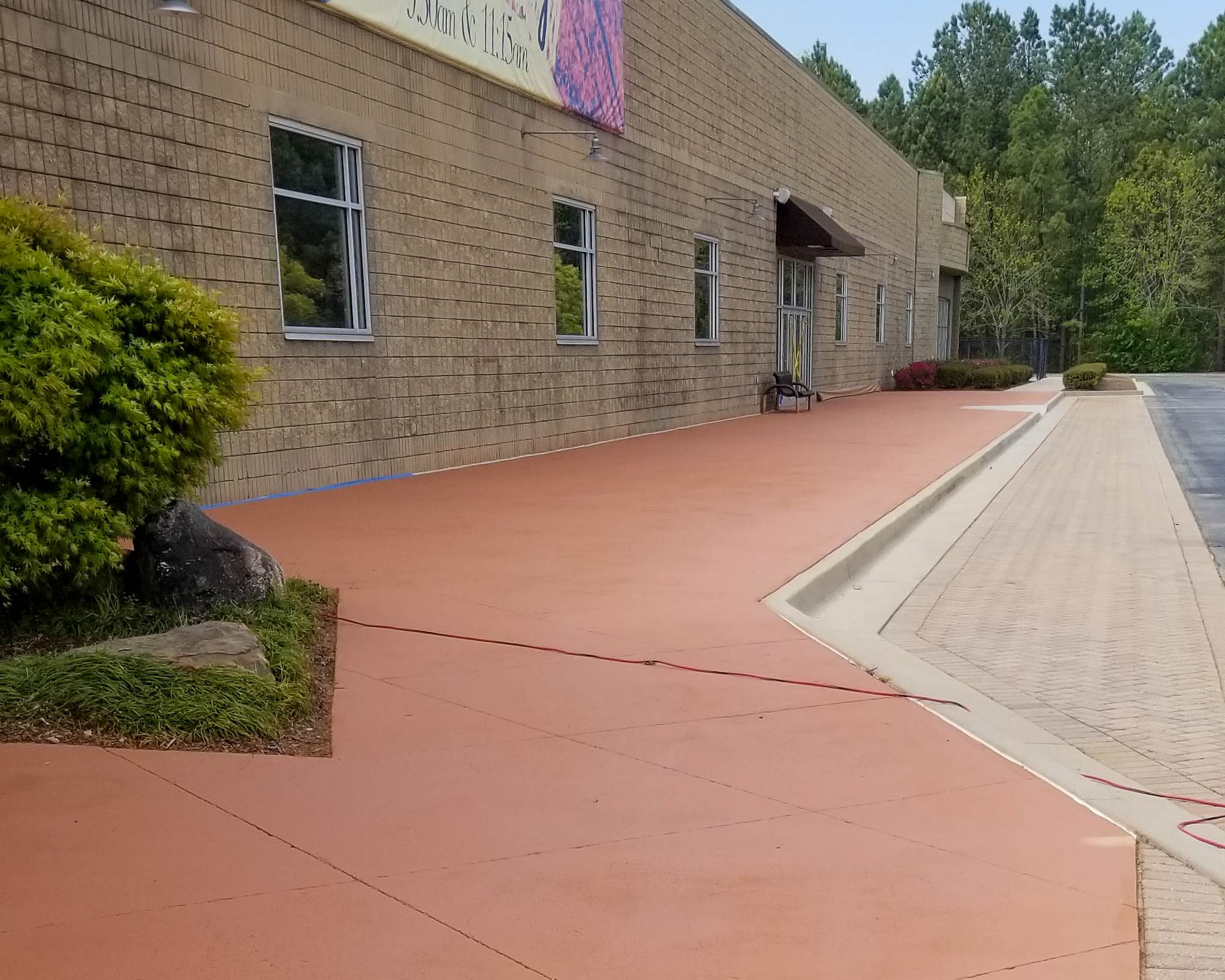 After sidewalk and parking lot pressure washing service