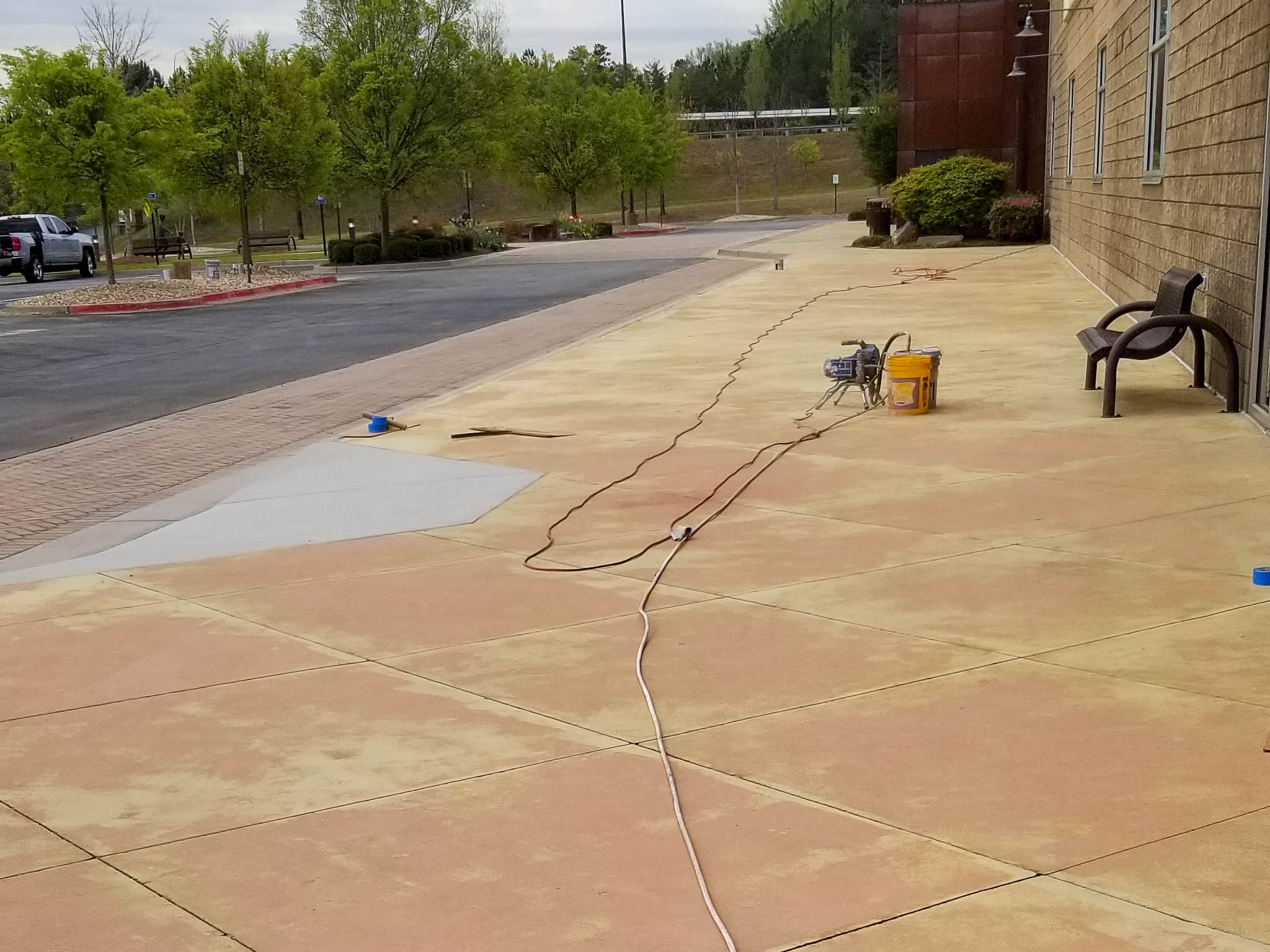 Before sidewalk and parking lot pressure washing service