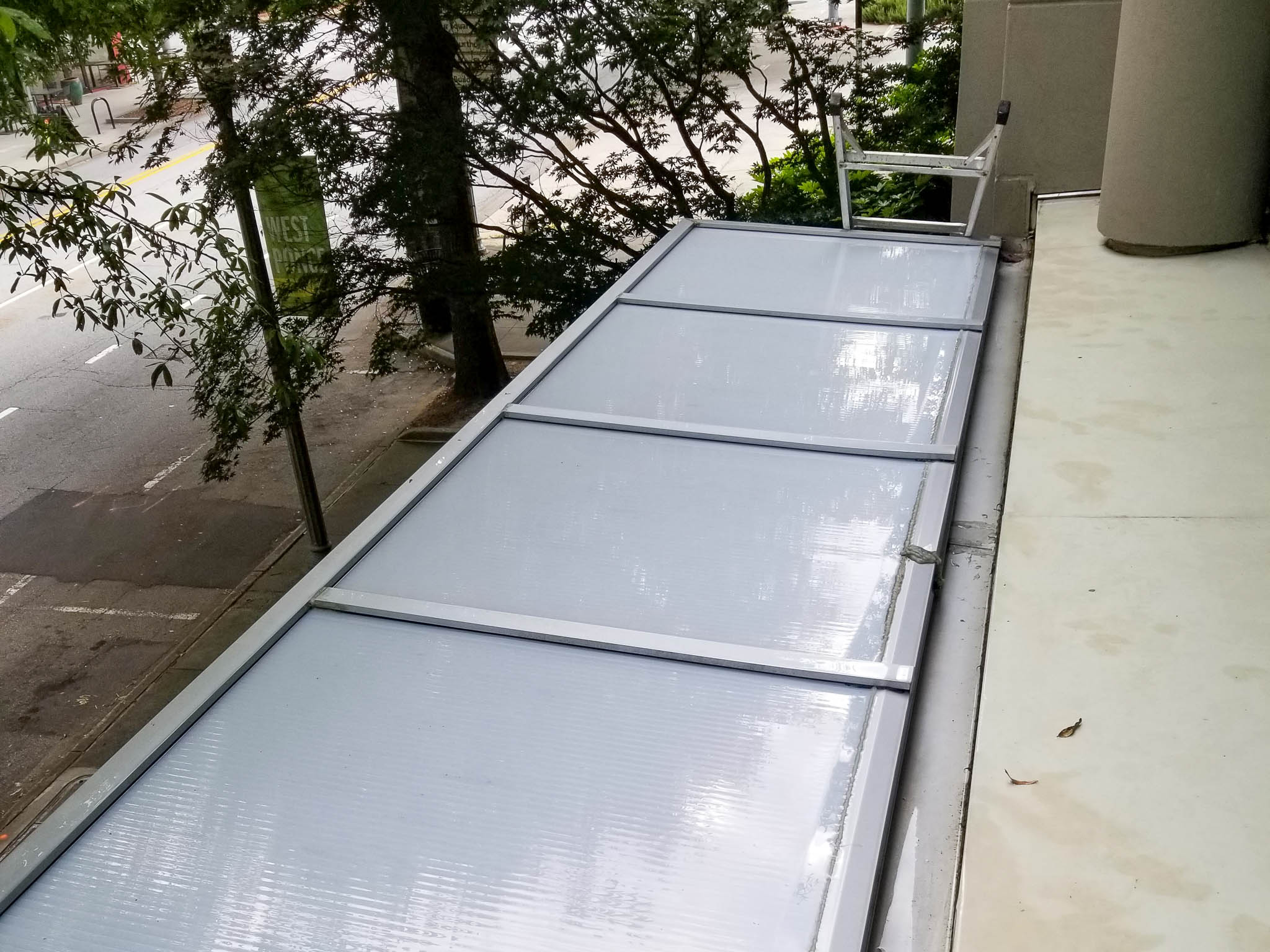 After pressure washing commercial office skylight and gutter cleaning