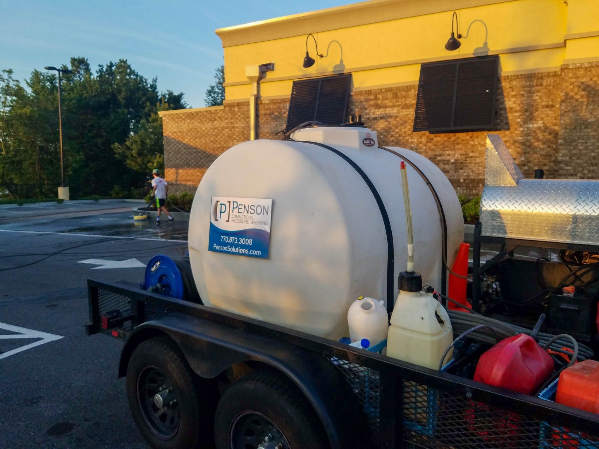 Photo of Penson Pressure Washing truck outside franchise restaurant